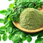 moringa-powder-moringa-oleifera-wooden-bowl-with-original-fresh-moringa-leaves-isolated-white_100801-583